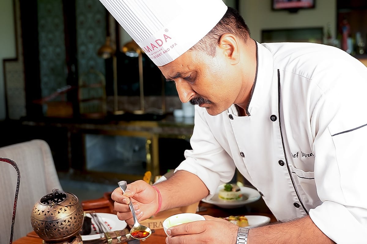 A cooking session with the chef at Ramada by Wyndham Udaipur Resort and Spa