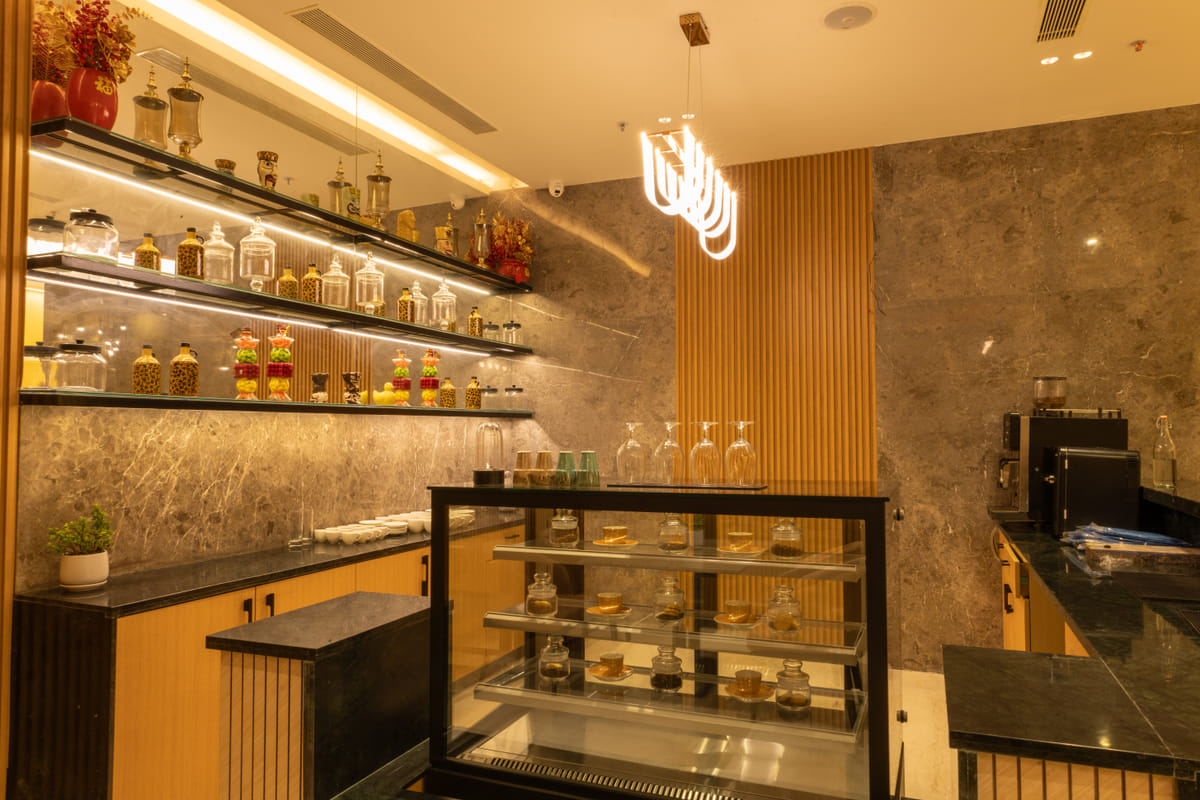 The Cafe counter and seating, a lobby-level coffee shop at Triumph Regency OMR Chennai