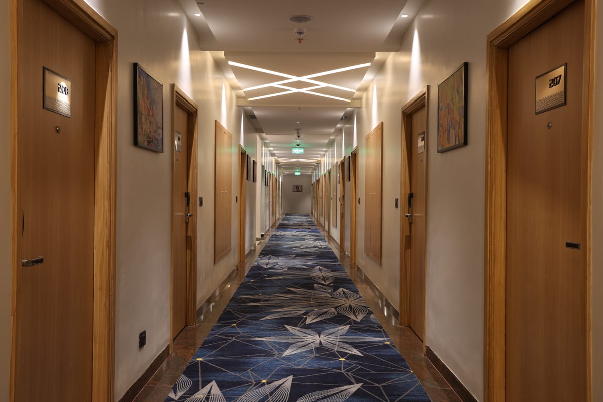 Guest-floor corridor at Triumph Regency OMR Chennai