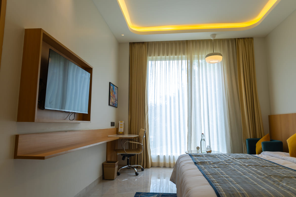 Executive King room with a king bed at Triumph Regency OMR Chennai