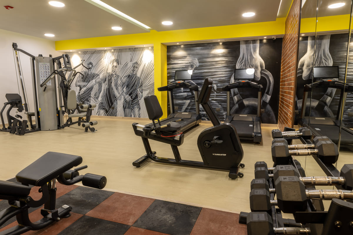 Gym equipment in the fitness centre at Triumph Regency OMR Chennai