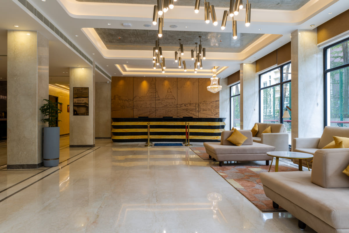 Seating area in the open lobby at Triumph Regency OMR Chennai