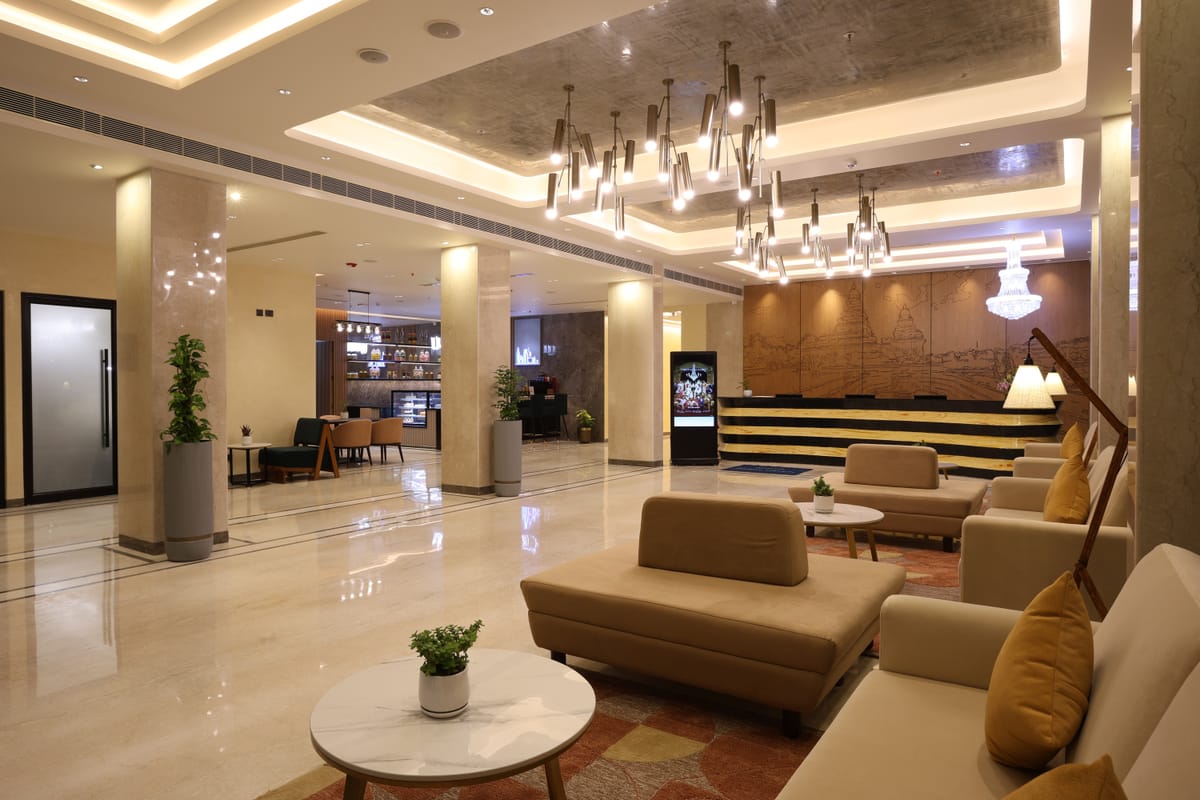Lounge seating in the lobby at Triumph Regency OMR Chennai