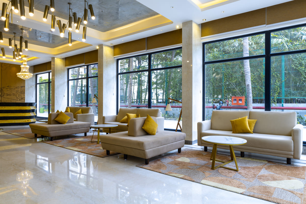Lounge seating corner in the lobby at Triumph Regency OMR Chennai