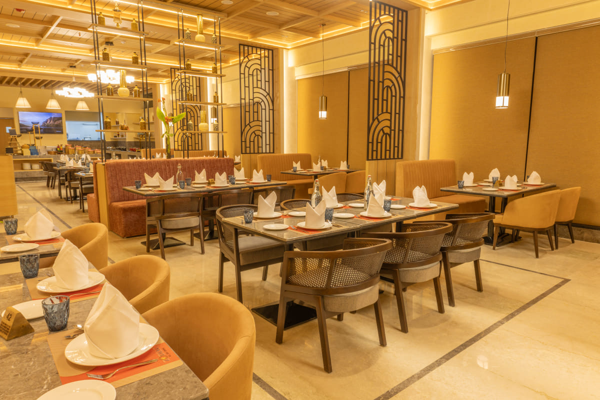 Upholstered booth seating at the multi-cuisine restaurant in OMR Chennai