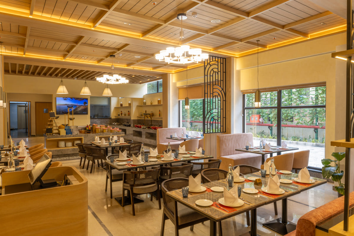 The garden-facing multi-cuisine restaurant at Triumph Regency OMR Chennai