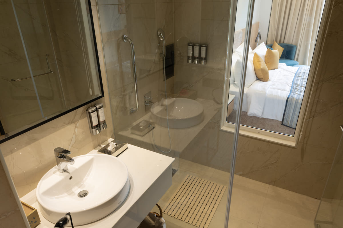 Bathroom fittings and shower area in the Triumph Club King room