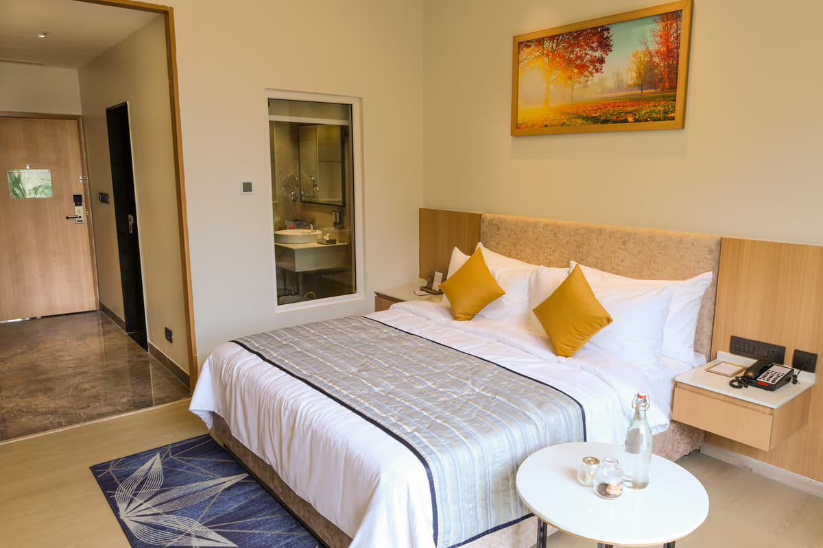 Spacious Triumph Club King room with a king bed and garden or city view at OMR Chennai
