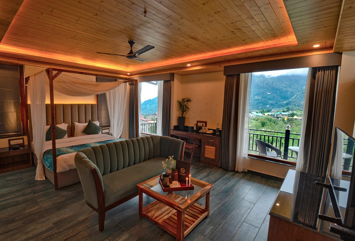 Canopy bed and coffee tray in a Luxurious Room at Nazaara Luxe Retreat, Manali