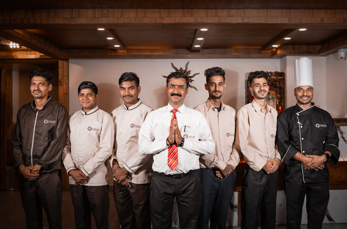 Staff team group photo at Nazaara Luxe Retreat, Manali