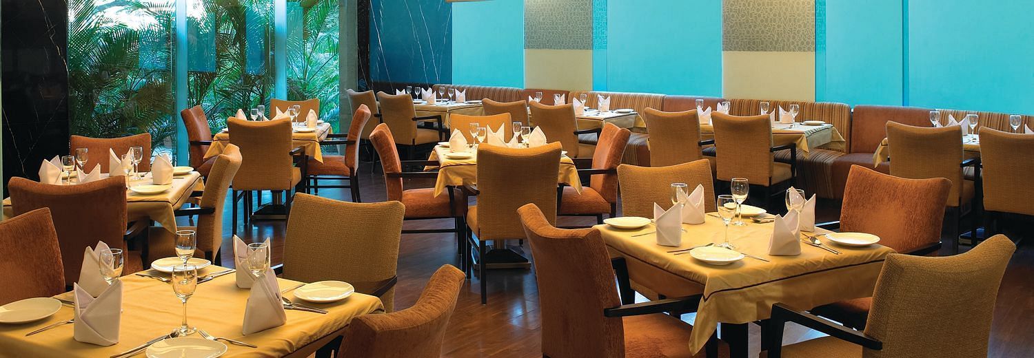 Shot of magnolia, our multi-cuisine restaurant with several seating arrangements | Mirage Hotel