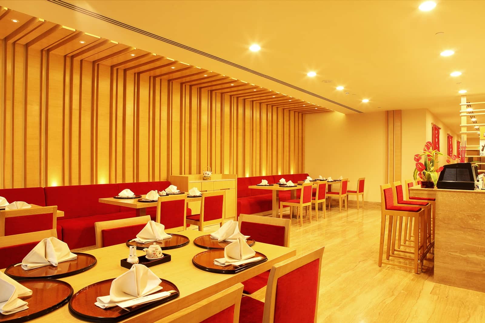 The red banquette seating along one wall of Sakura