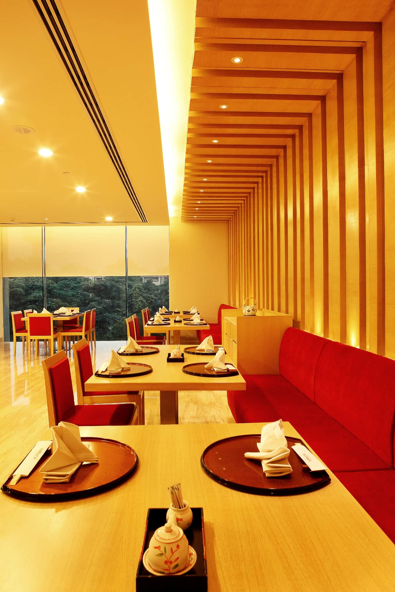 Banquette tables set for dinner at Sakura
