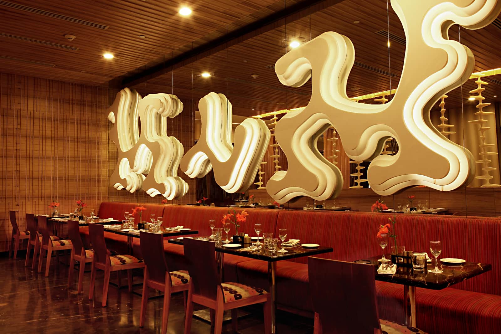 The dining room at Zing, under its lights