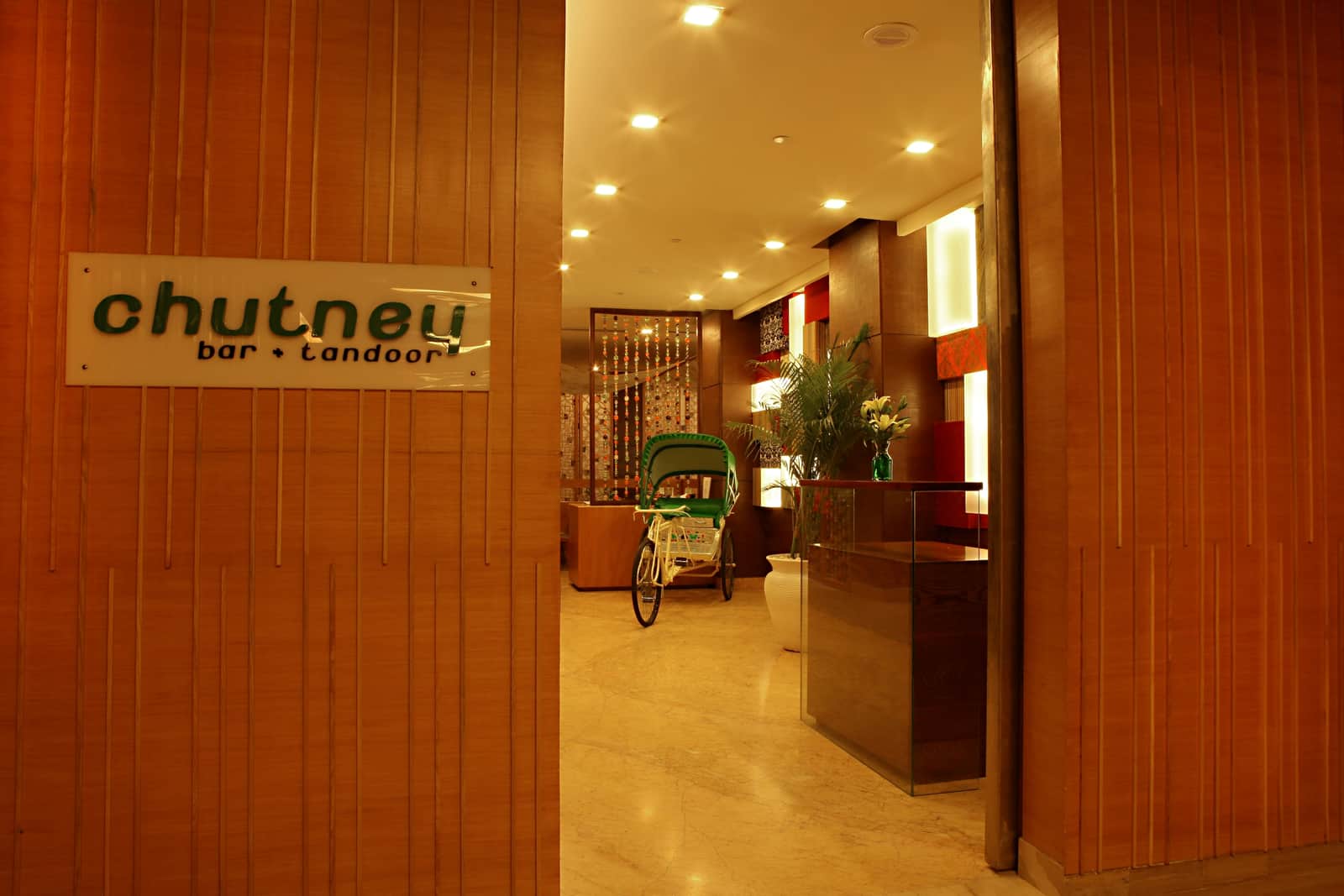 The entrance to Chutney, Bar + Tandoor beneath its name board
