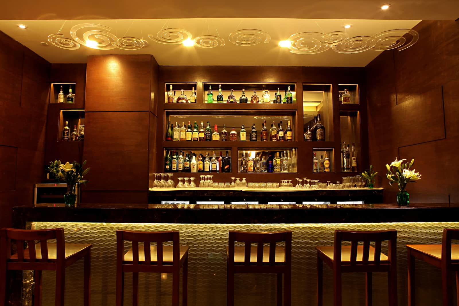The bar at Chutney, bottles ranged on the back shelves