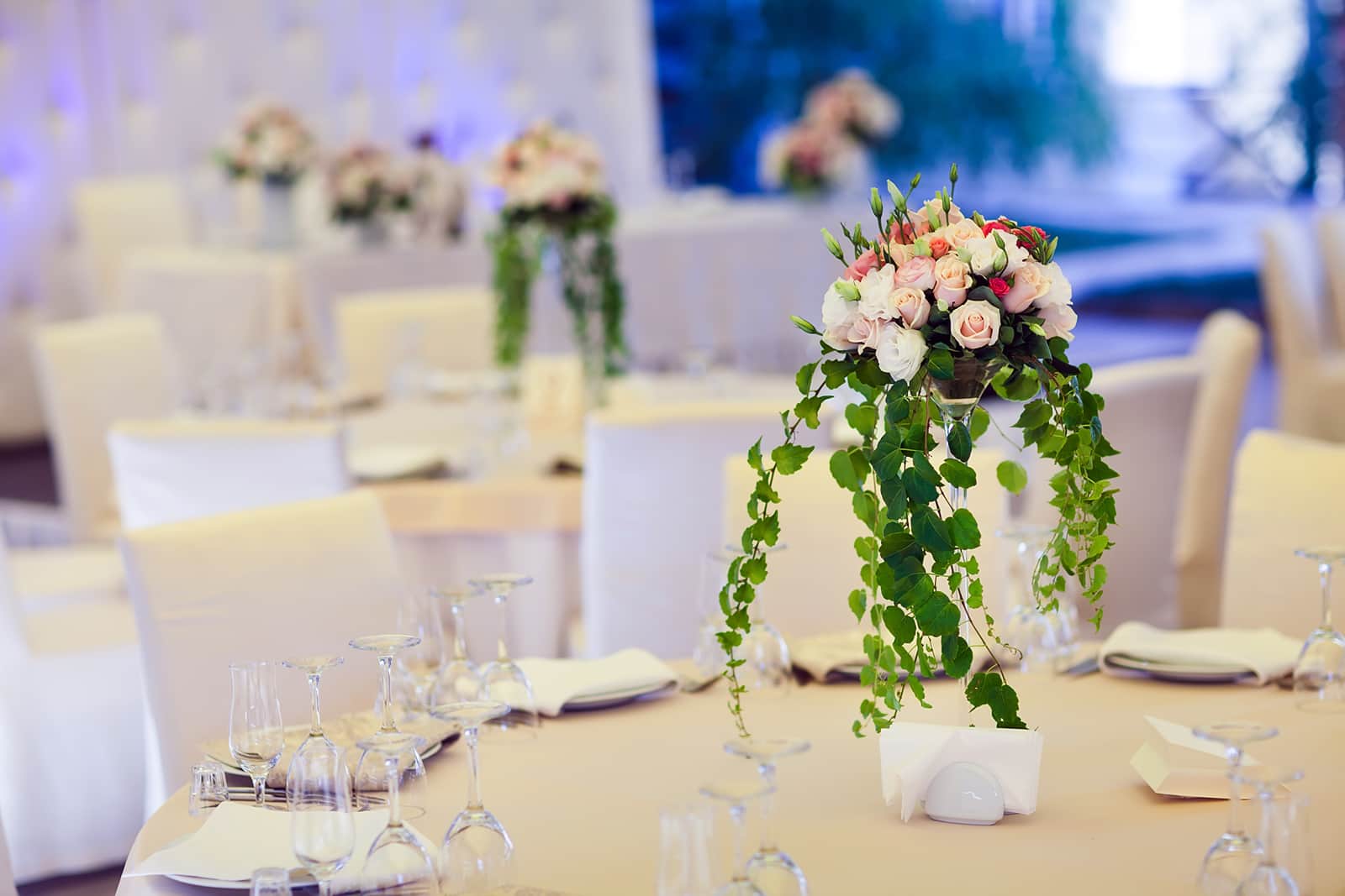 A banquet table set with a floral centrepiece