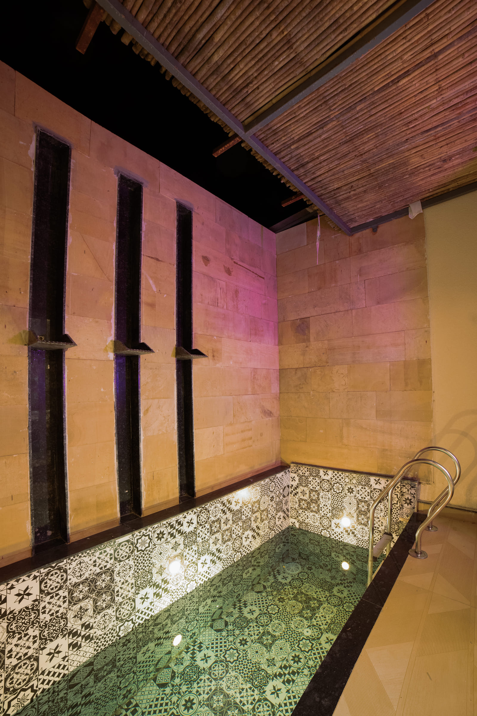 Private plunge pool outside the Premium Plunge Pool Room at Nazaara Hills Retreat, Udaipur, lit at night