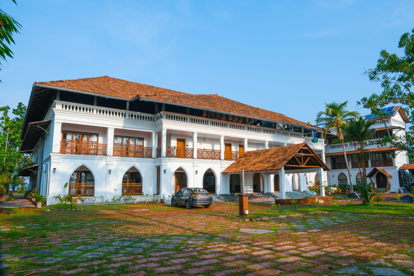 Arched verandahs and terracotta rooftops of Sanskreti, a blend of traditional Kerala and Portuguese-colonial architecture, Kumbalanghi, Kochi