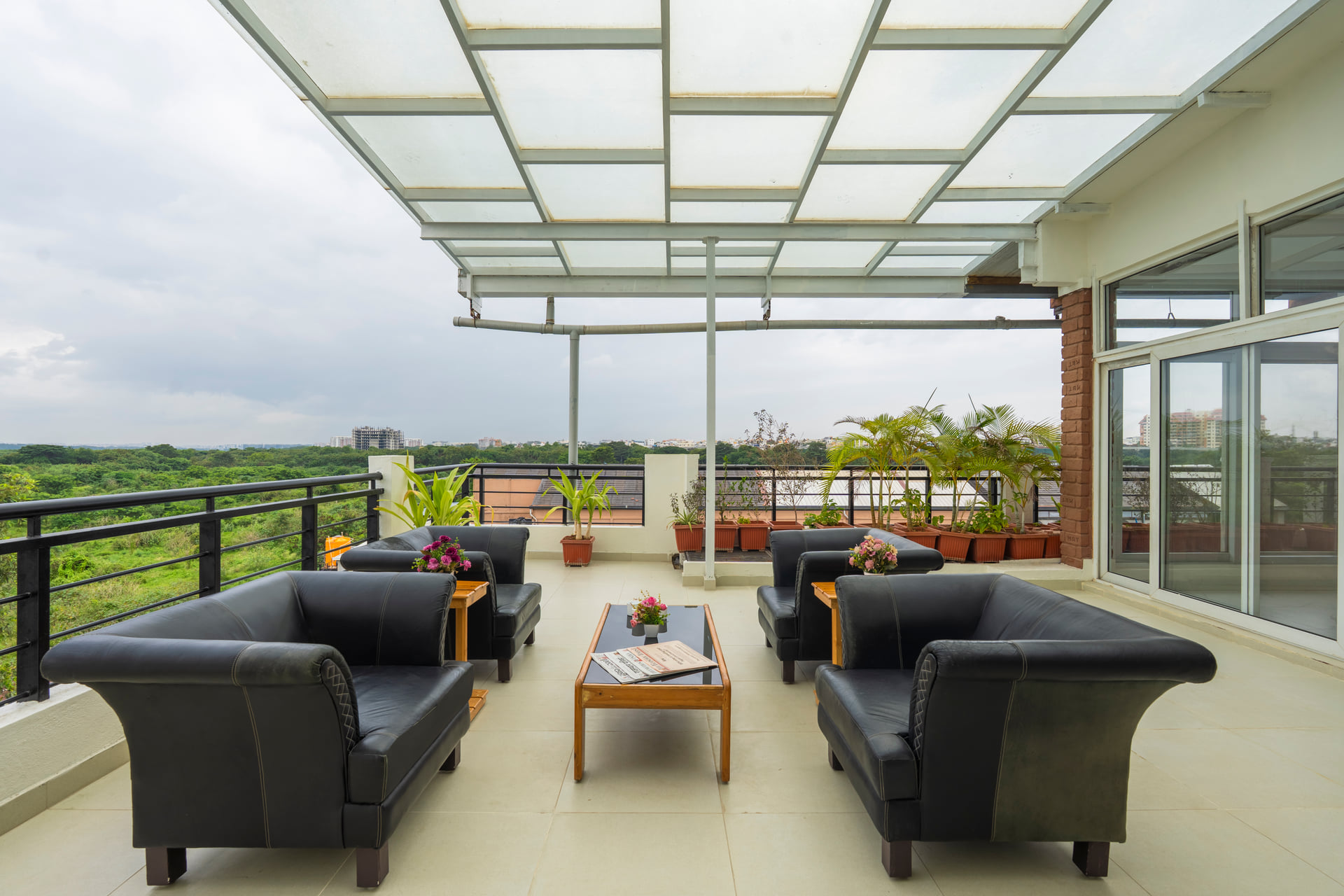 The 24-hour terrace lounge with black leather sofas