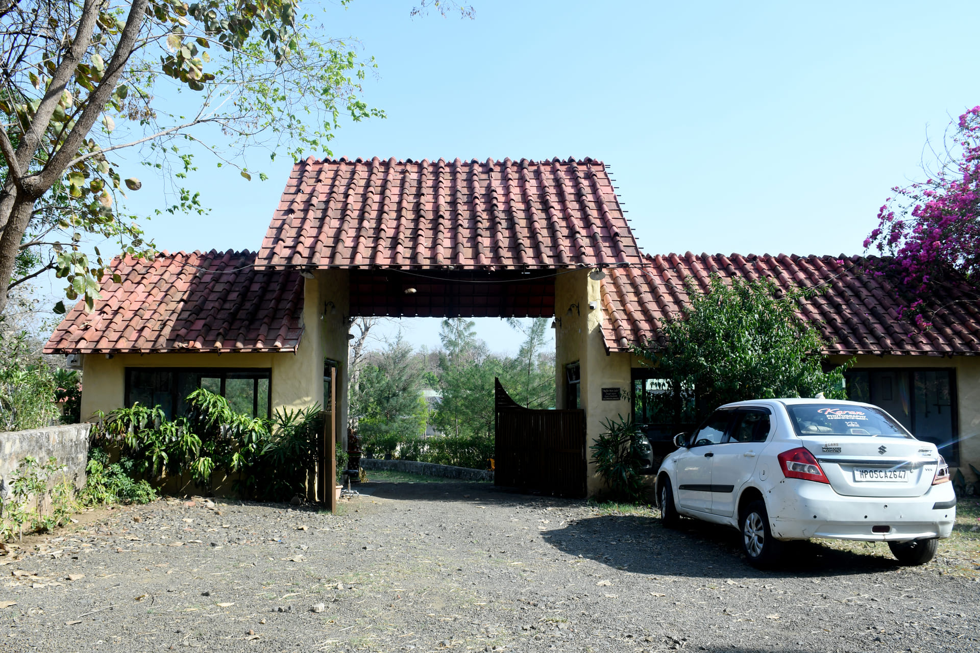 Stone gate at the entrance to The Rustik, Satpuda