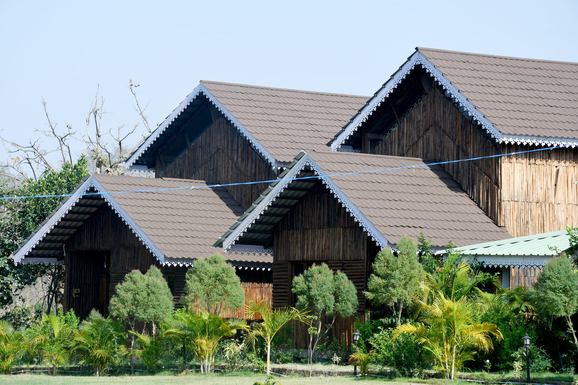 Teak Wooden Villa interior with cane headboard