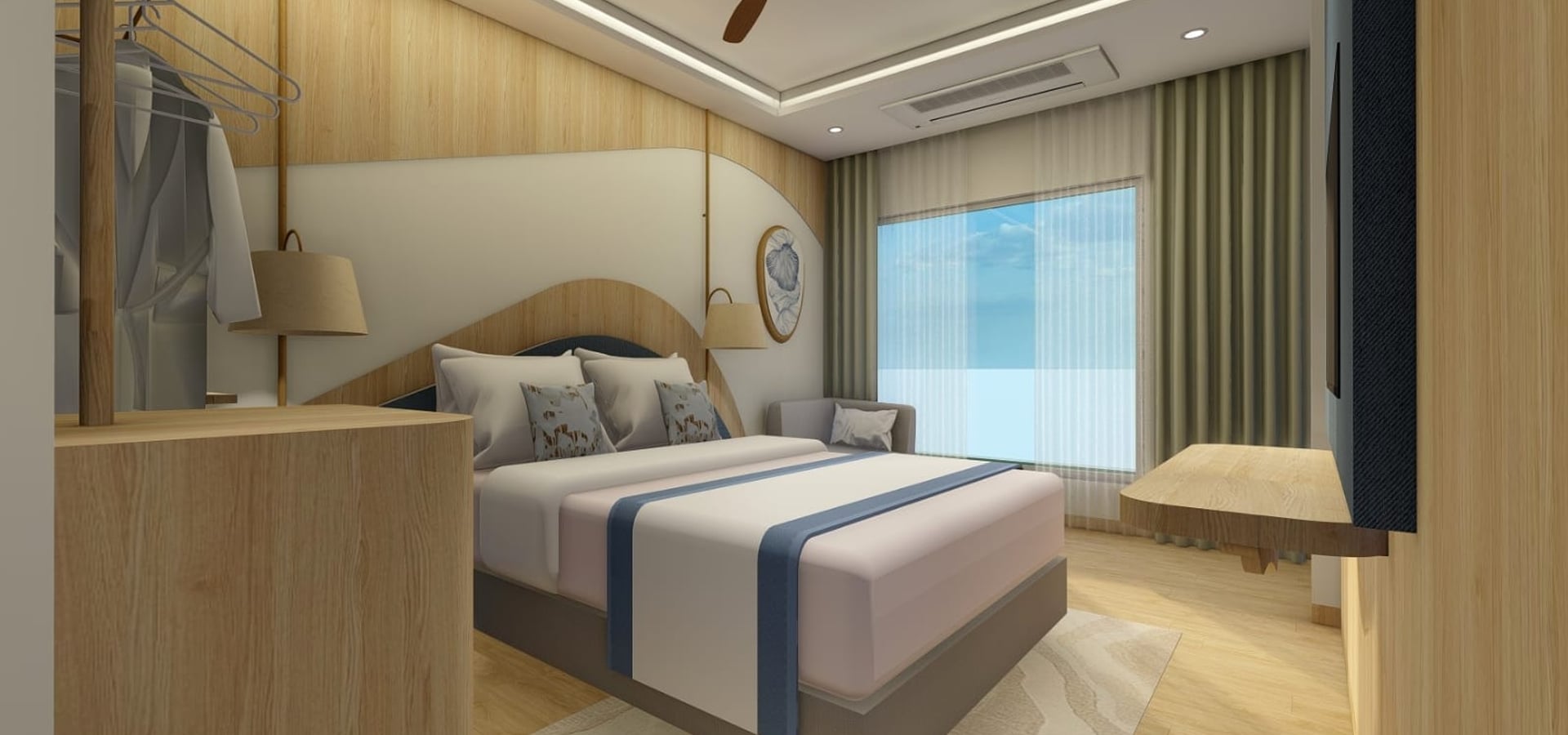 Sea View Room with a king bed facing tall windows and a grey sofa in the corner | Shirgaonkar Beach Resort