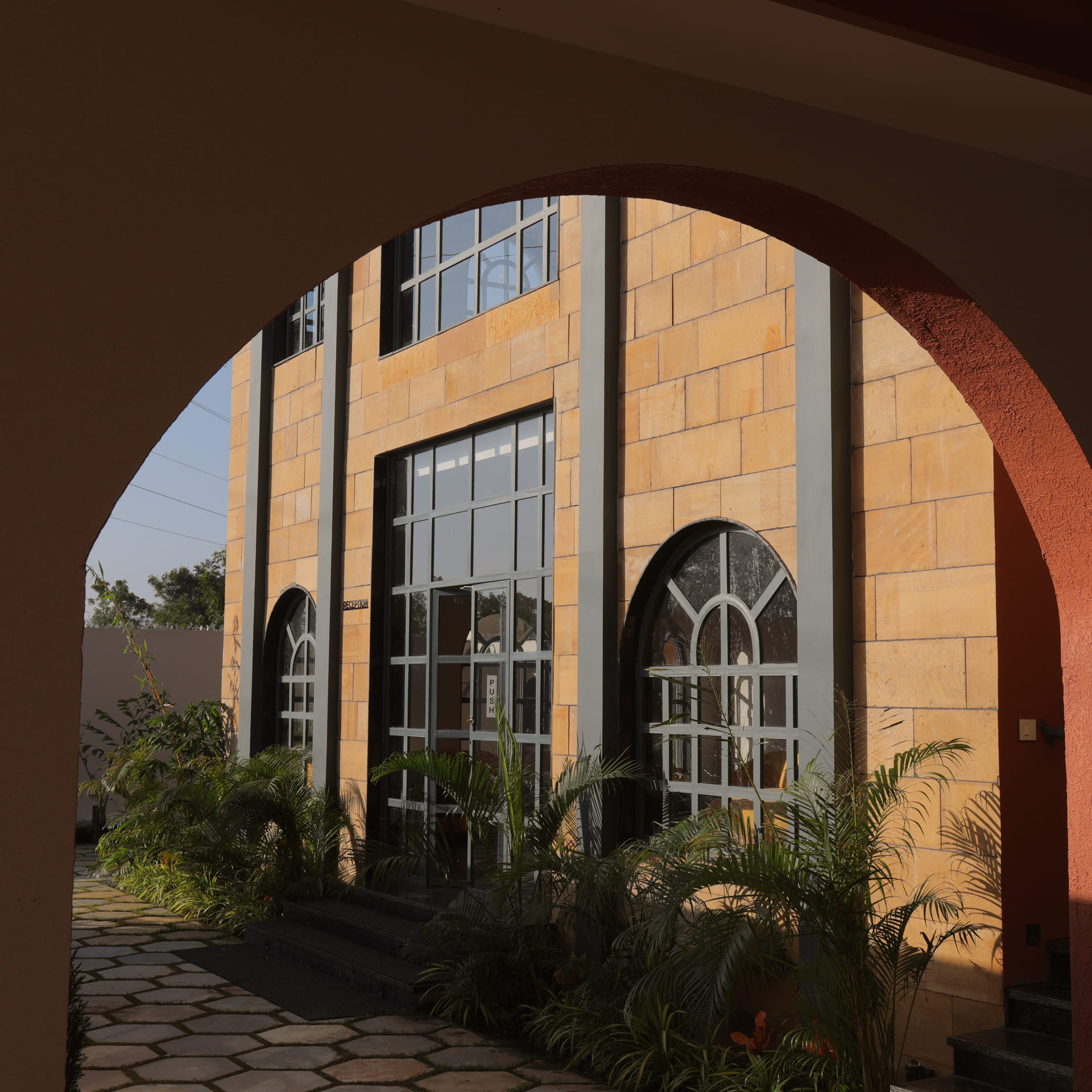 Archway entrance to the reception at Nazaara Hills Retreat, Udaipur, seen from outside