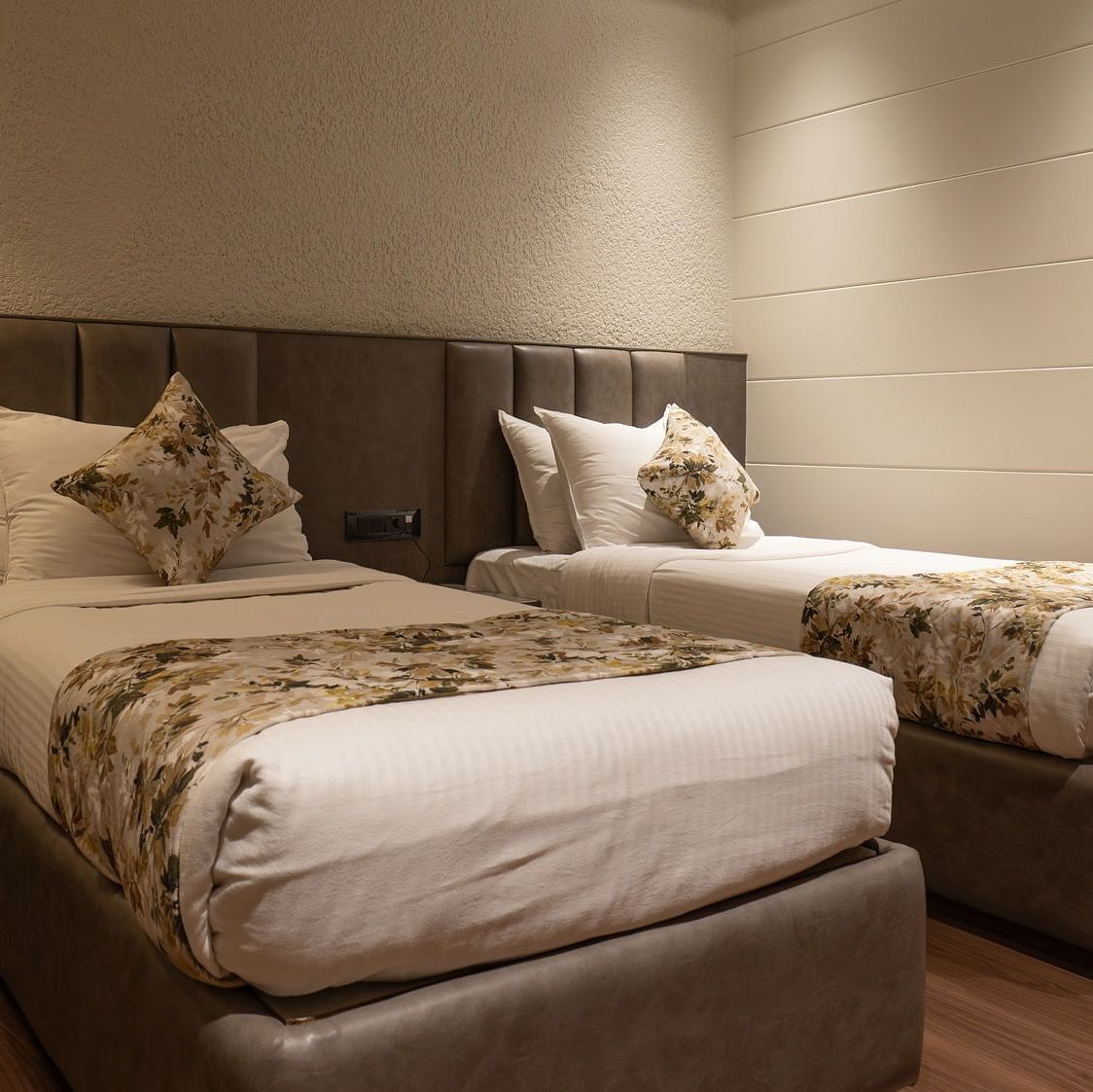 Twin beds inside the deluxe room - The Cindrella Hotel, Siliguri