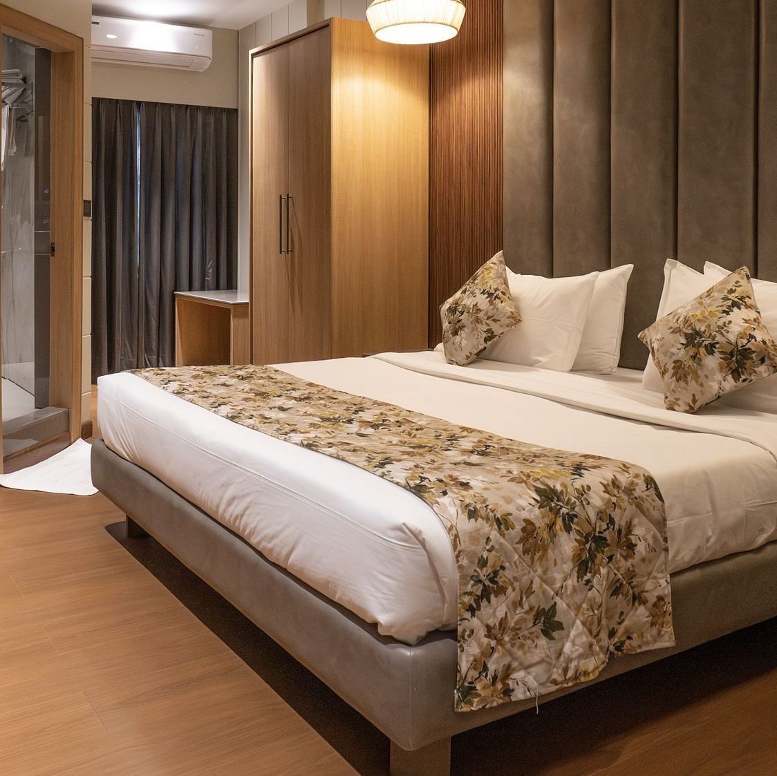 Side view of the double bed inside executive room - The Cindrella Hotel, Siliguri