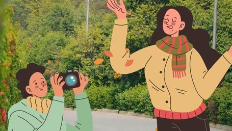 Illustration of a cheerful couple at Karma Chalets, with one person taking photos while the other poses joyfully with falling autumn leaves.
