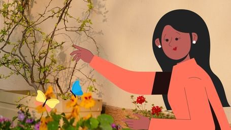 Illustration of a woman in a garden at Karma Chalets, admiring colorful flowers and butterflies near a villa wall with plants.