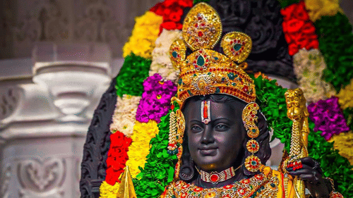 Statue of Lord Rama adorned with flowers and jewellery.