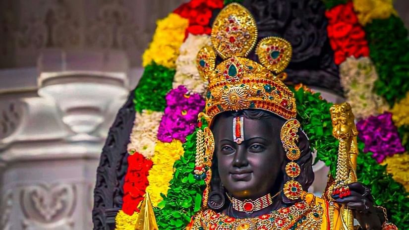 Statue of Lord Rama adorned with flowers and jewelry.