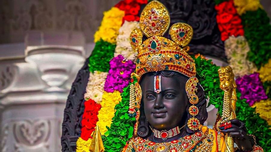 Statue of Lord Rama adorned with flowers and jewelry.