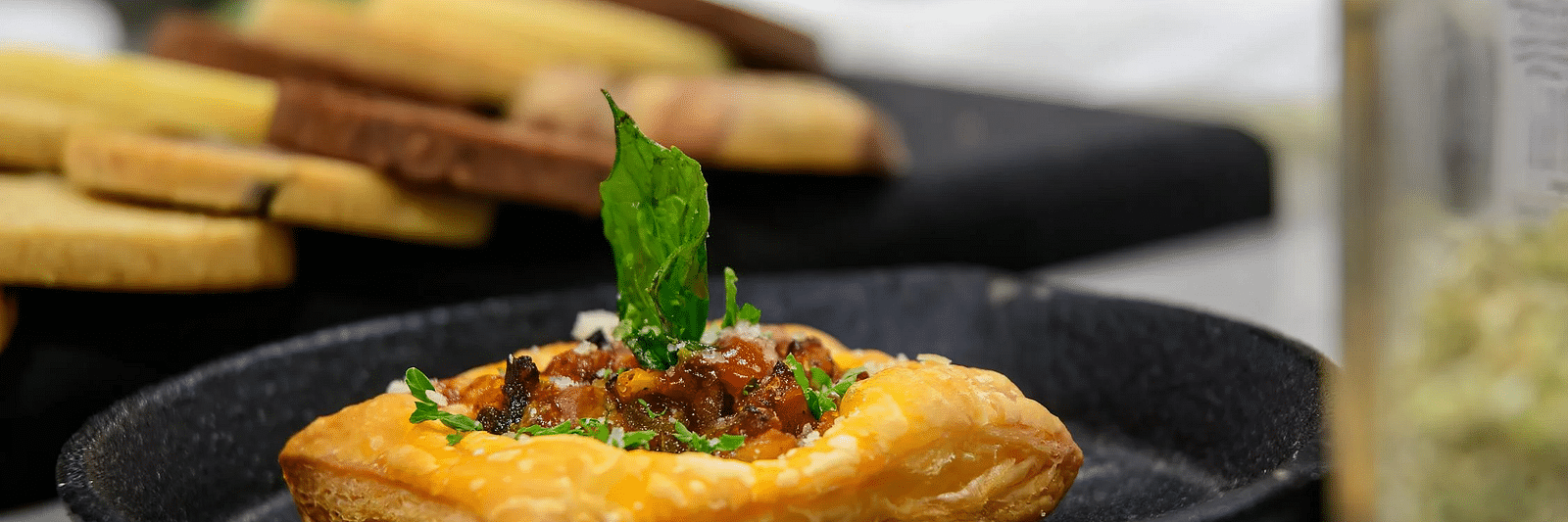 A plate of baked goods topped with garnishing