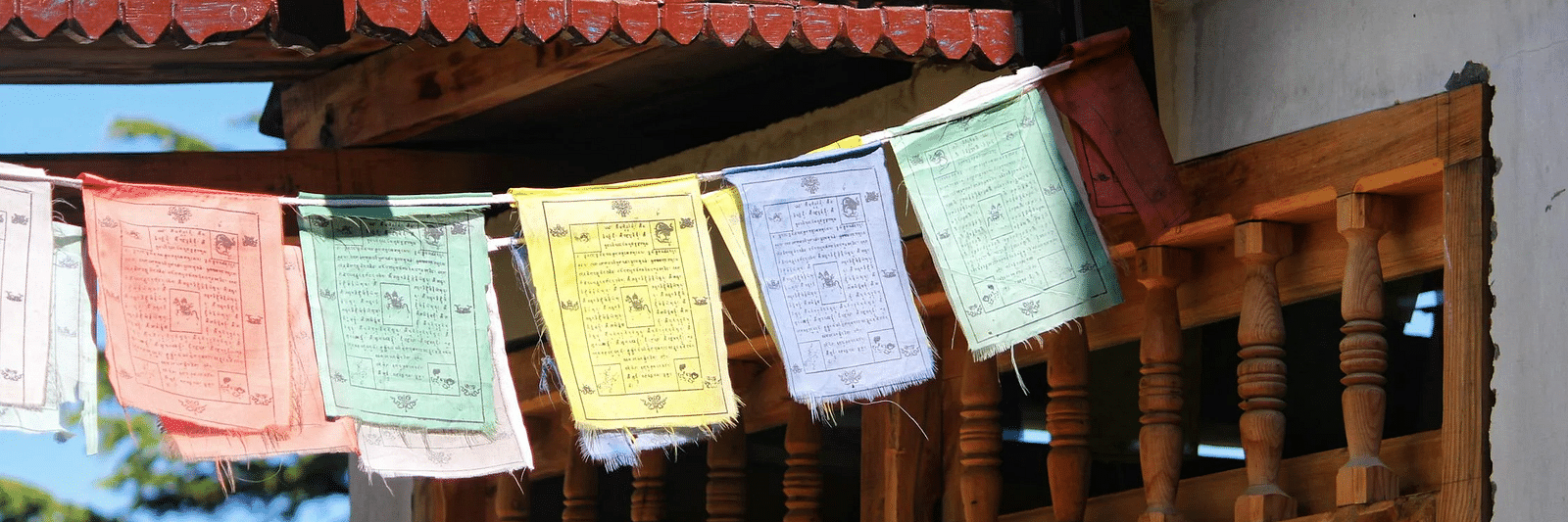 Buddhist prayer flags hanging from a house