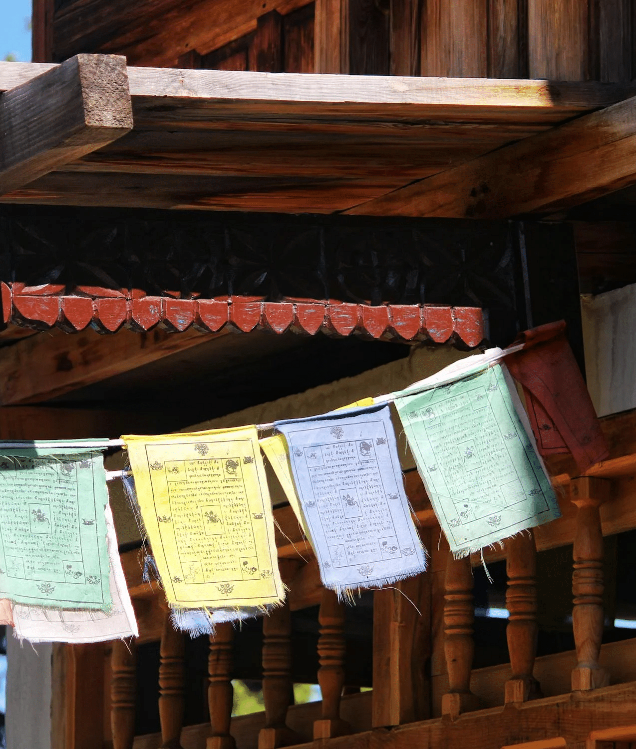 Buddhist prayer flags hanging from a house