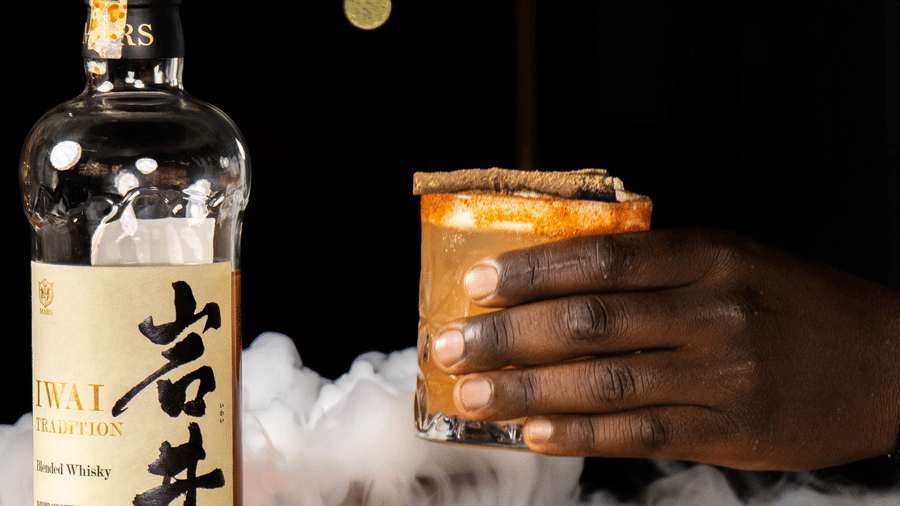 Bottle and glass with dry ice at Asiatic Rooftop Bar and Restaurant.