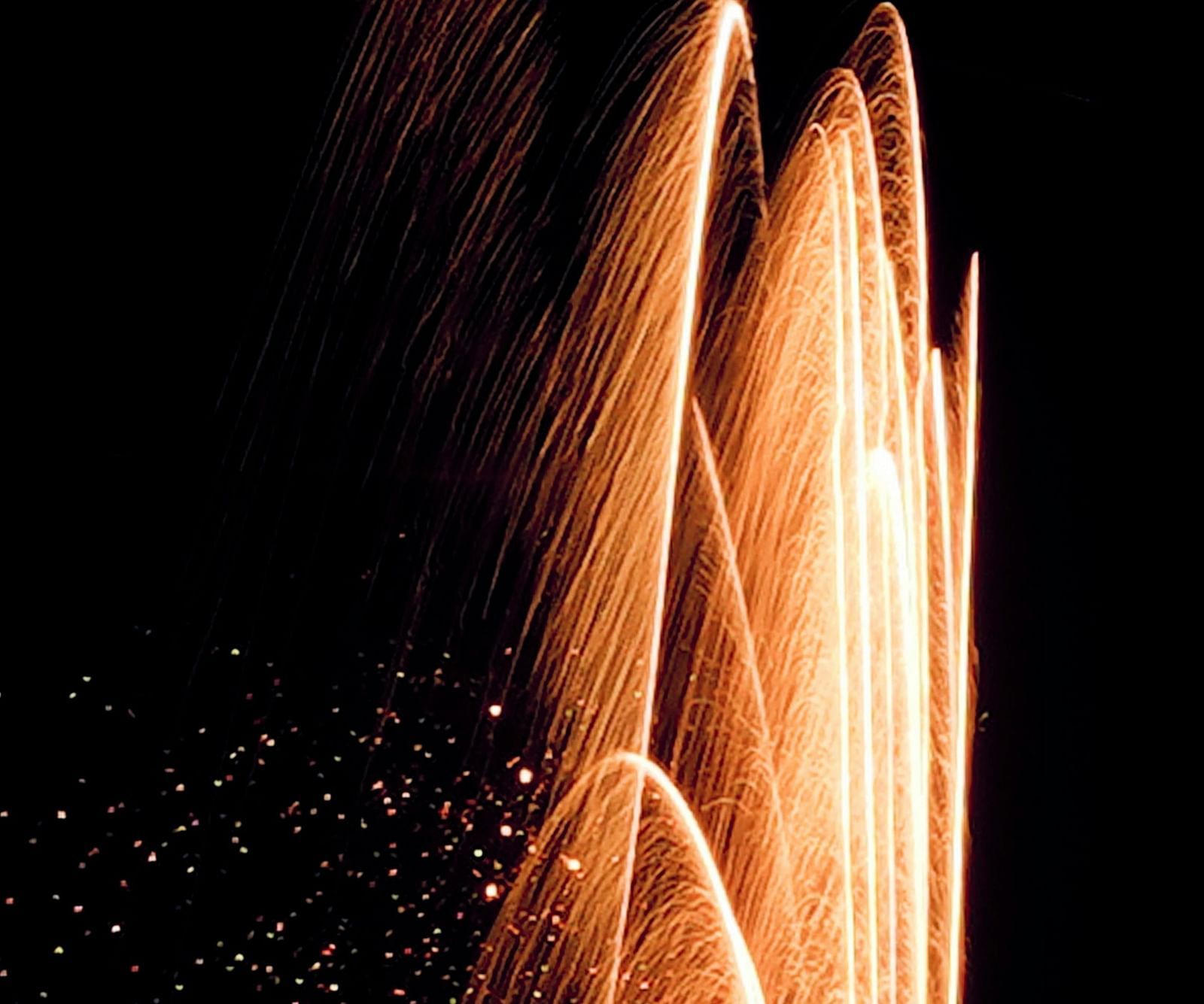 image of a fountain illuminated with yellow light