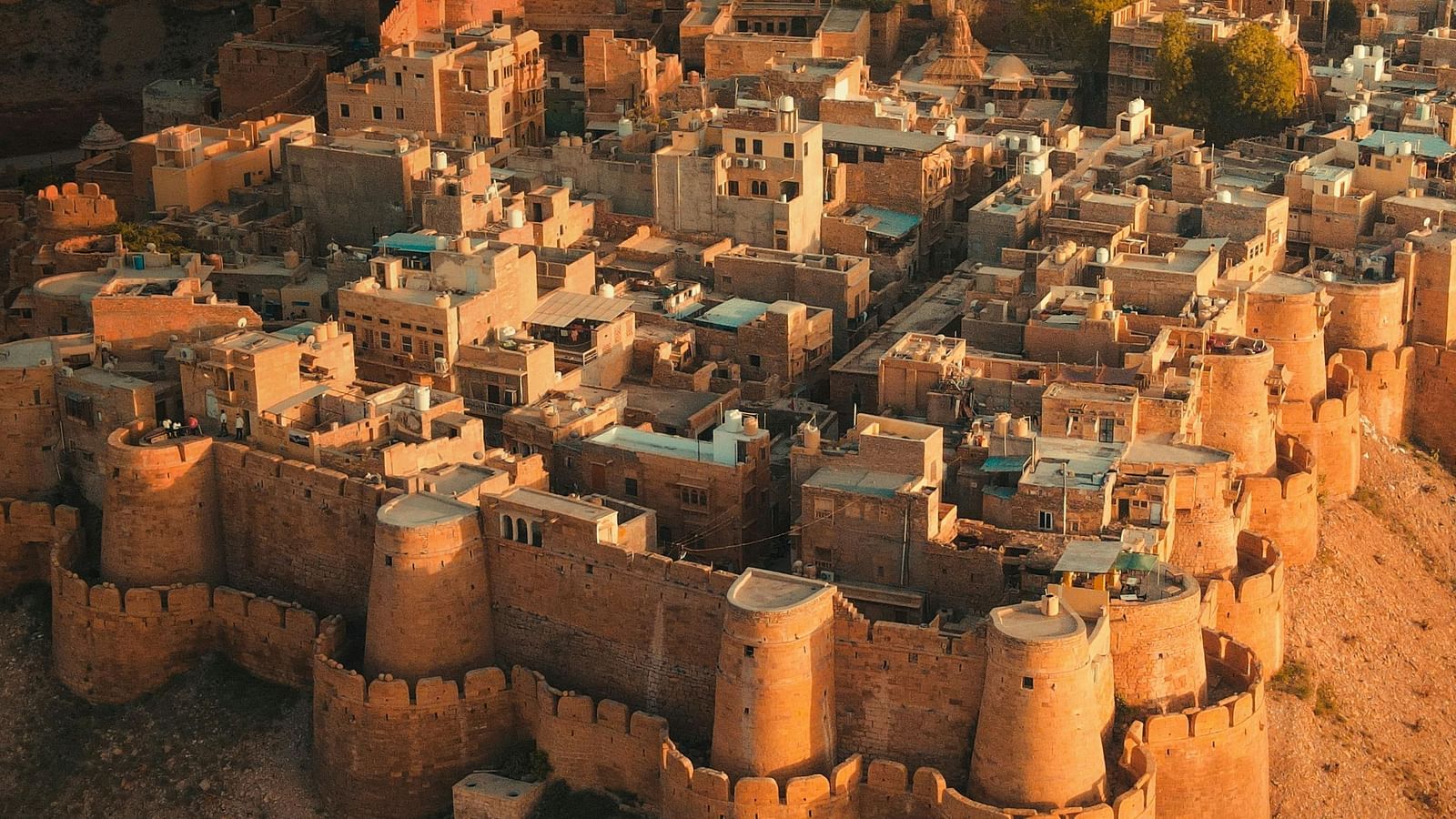 an Aerial view of the jaisalmer fort at an evening  with the golden hour