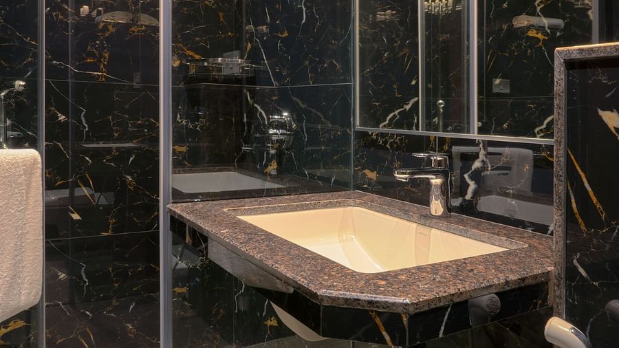 An overview of the shower area inside the bathroom of Deluxe Suite - Magnus Nexstar Suites, Pune
