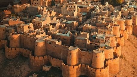 an Aerial view of the jaisalmer fort at an evening  with the golden hour