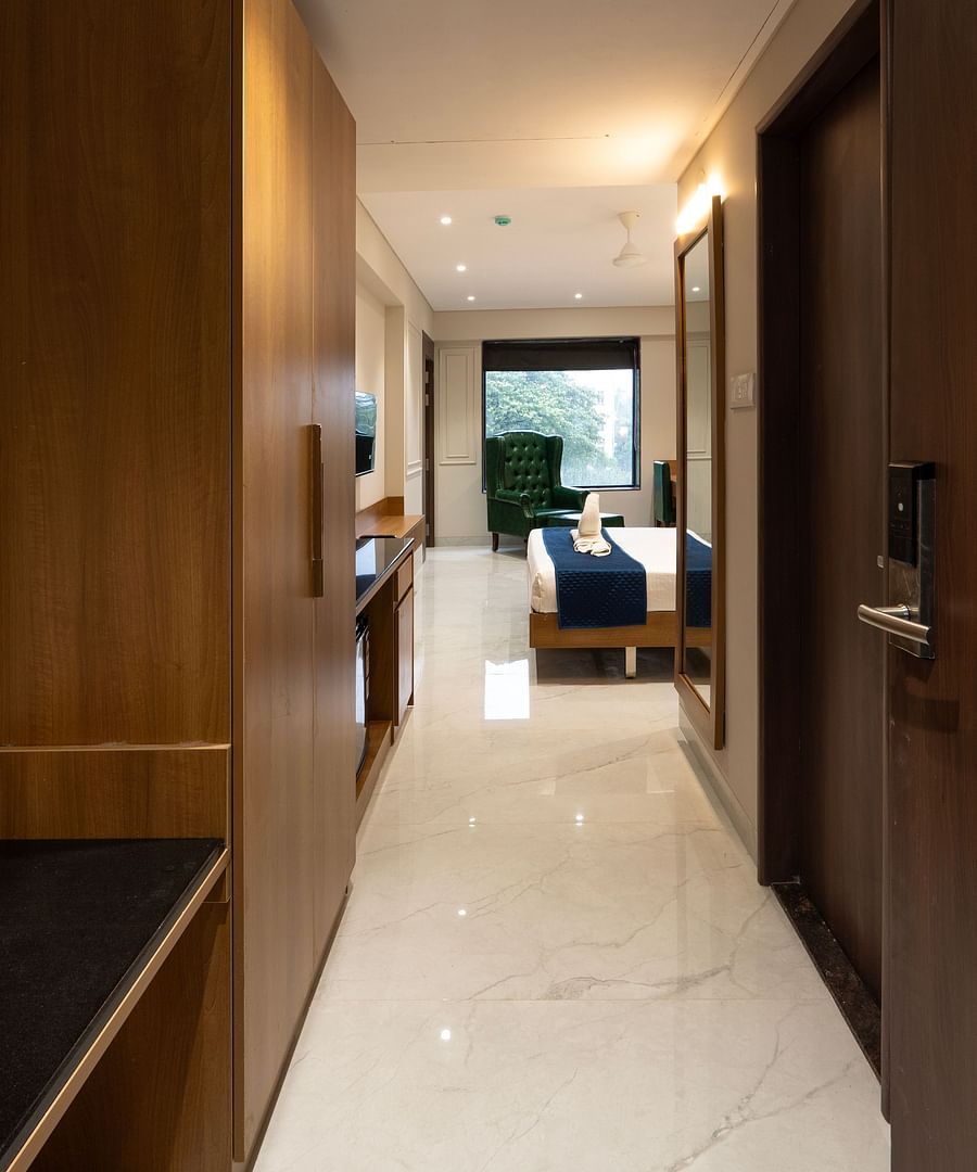 Entrance to the Deluxe Suite with a double bed inside - Magnus Nexstar Suites, Pune