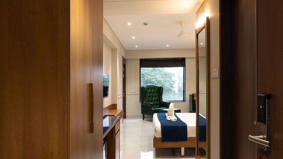 Entrance to the Deluxe Suite with a double bed inside - Magnus Nexstar Suites, Pune