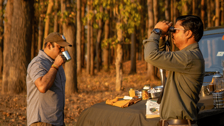 Forest personnel drinking coffee and preparing for safari in Jim Corbett