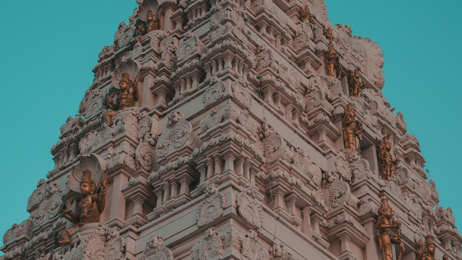 Lower angle view of a temple showcasing intricate stone architecture.