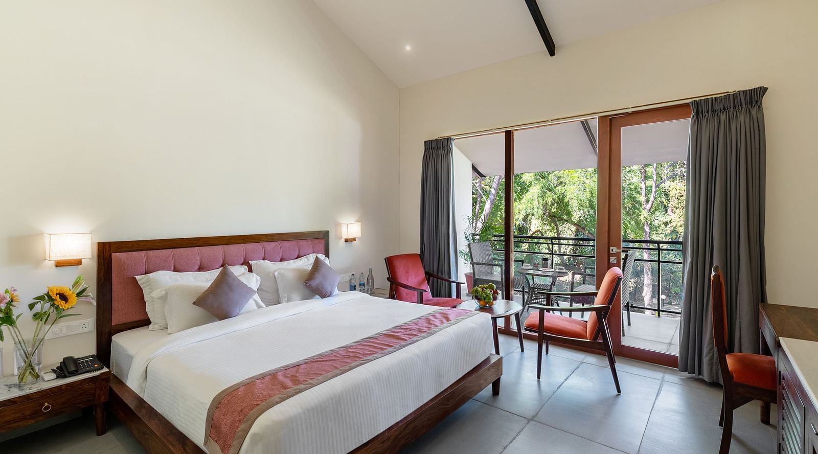 image of the luxury cottage room at aranya vilas featuring a plush king size bed 