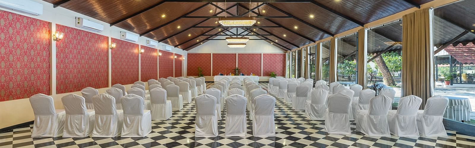 image of the banquet hall at aranya vilas with chairs set in a typical theatre setting 