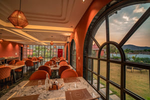 Nazaara Fine Dine, the restaurant at Nazaara Hills Retreat, Udaipur, with arched windows